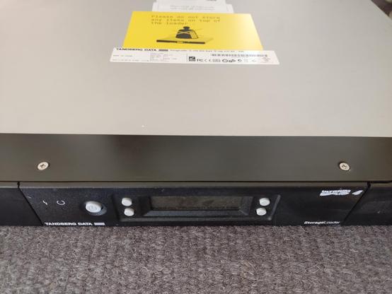 front of a 1U LTO4 tape library placed on the floor