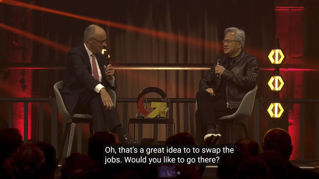 Screenshot "Fireside Chat" von Merz und Huang. Caption: "Oh, that's a great idea, to swap the jobs. Would you like to go there?"