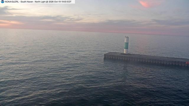 View of north pierhead light in South Haven from the south pier lighthouse. // Image captured at (local time): 2026-10-19 19:03:01 EDT (about 4 min. prior to this post) // Image sourced from: glerl.noaa.gov/metdata/shv/ // Current Temp in South Haven: 54 F | 12 C // Precip: overcast clouds // Wind: N at 1 mph | 2 kph // Humidity: 74%