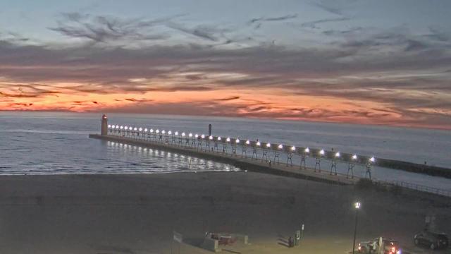 View looking WNW over South Beach with the South Haven Lighthouse and channel entrance jutting into Lake Michigan. // Image captured at (local time): 2026-10-19 19:36:13 EDT (about 1 min. prior to this post) // Image sourced from: youtube.com/@cityofsouthhaven // Current Temp in South Haven: 52 F | 11 C // Precip: overcast clouds // Wind: N at 0 mph | 0 kph // Humidity: 76%