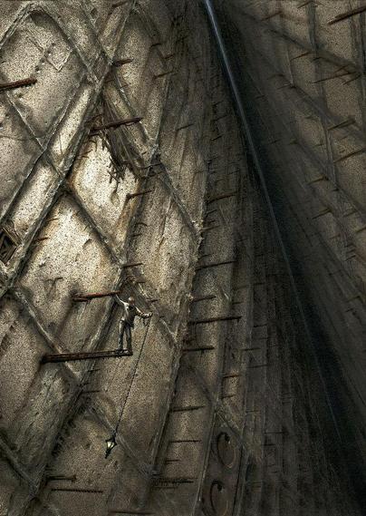 A man stands on an outcrop of rebar in the space between two massive stone walls. In one hand he struggles with a lamp hanging on a long heavy chain while his other grips a rusted piece of metal anchored to the stone facade. Up high and barely visible is a thin line of hazy daylight that he can't see because he's looking down.