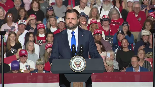 Vice President Vance speaking to a crowd from behind a podium, “which is why we made English profirssency mandatory to obtain a commercial drivers license in this state and all across our country.”