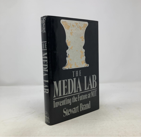 Front cover of a book. The title is "The Media Lab, Inventing the Future at MIT" The author is Stewart Brand.