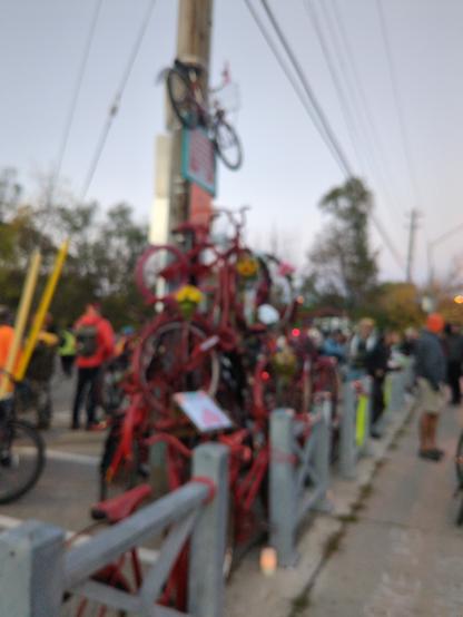 A makeshift monument of bikes spray painted red