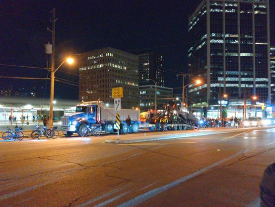 Bike cops have pulled up in front of the first truck.