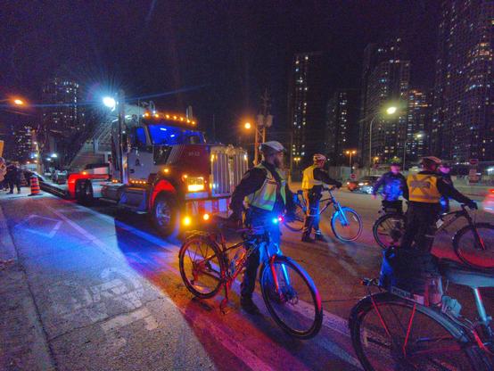 Bike cops clearing a path in front of truck
