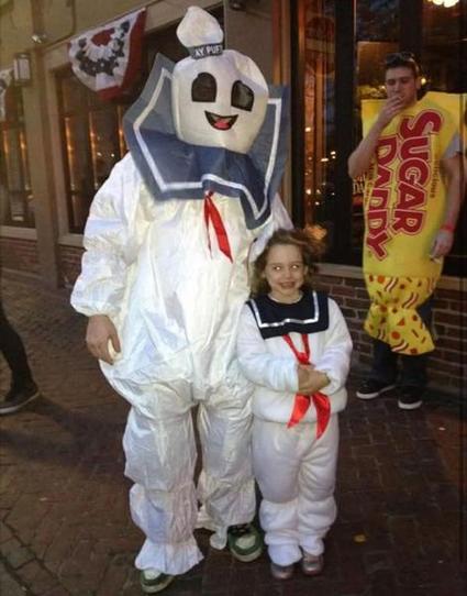 Man and girl both dressed as Stay Puft Marshmallow Men