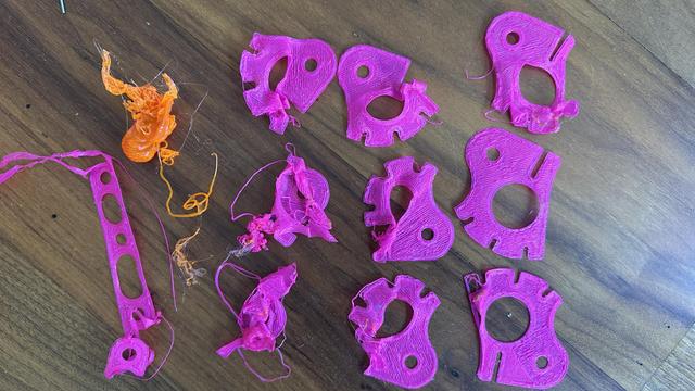 Lots of failed prints with various levels of mangling.