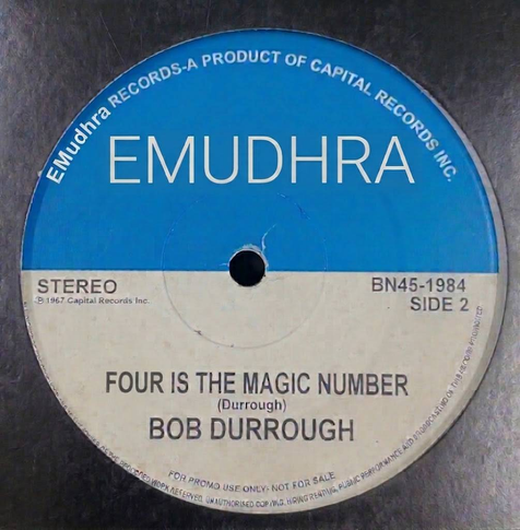 Photo of Bob Durrough's "3 is the magic number" record centre label. "Blue Note" has been changed to "EMudhra" and the title reads "4 is the magic number"