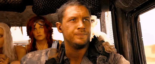 Tom Hardy as Max in Mad Max: Fury Road driving along and pointing upwards while saying, “Uh uh… THAT’S BAIT”
