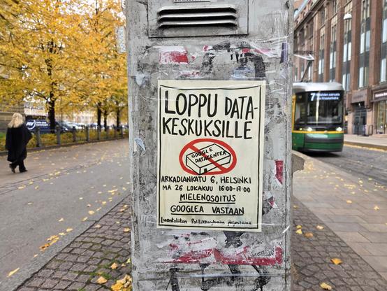 Hand drawn poster taped to an electricity box. Shows a box-like warehouse with "GOOGLE DATACENTER" on the roof, and a big red "no entry" circle on top.