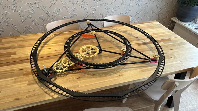 Large clockwork mechanism on a dining room table