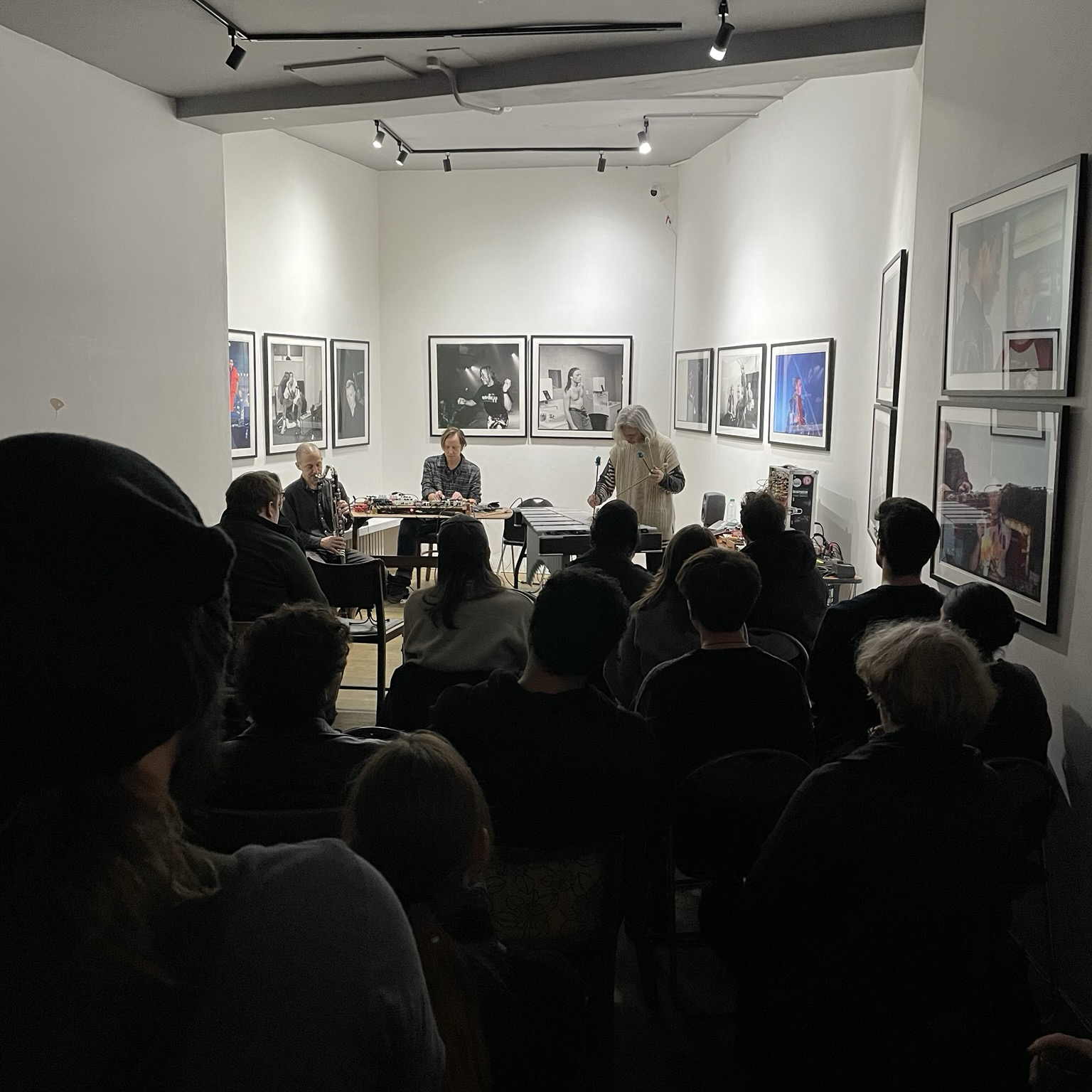 Yoni Silver, Bill Thompson and Jacqui Walduck playing their trio set at Mercury Over Maps. It’s a gallery space with a photographic exhibition of the band The Prodigy up on the walls, which looks great, and the house is packed.